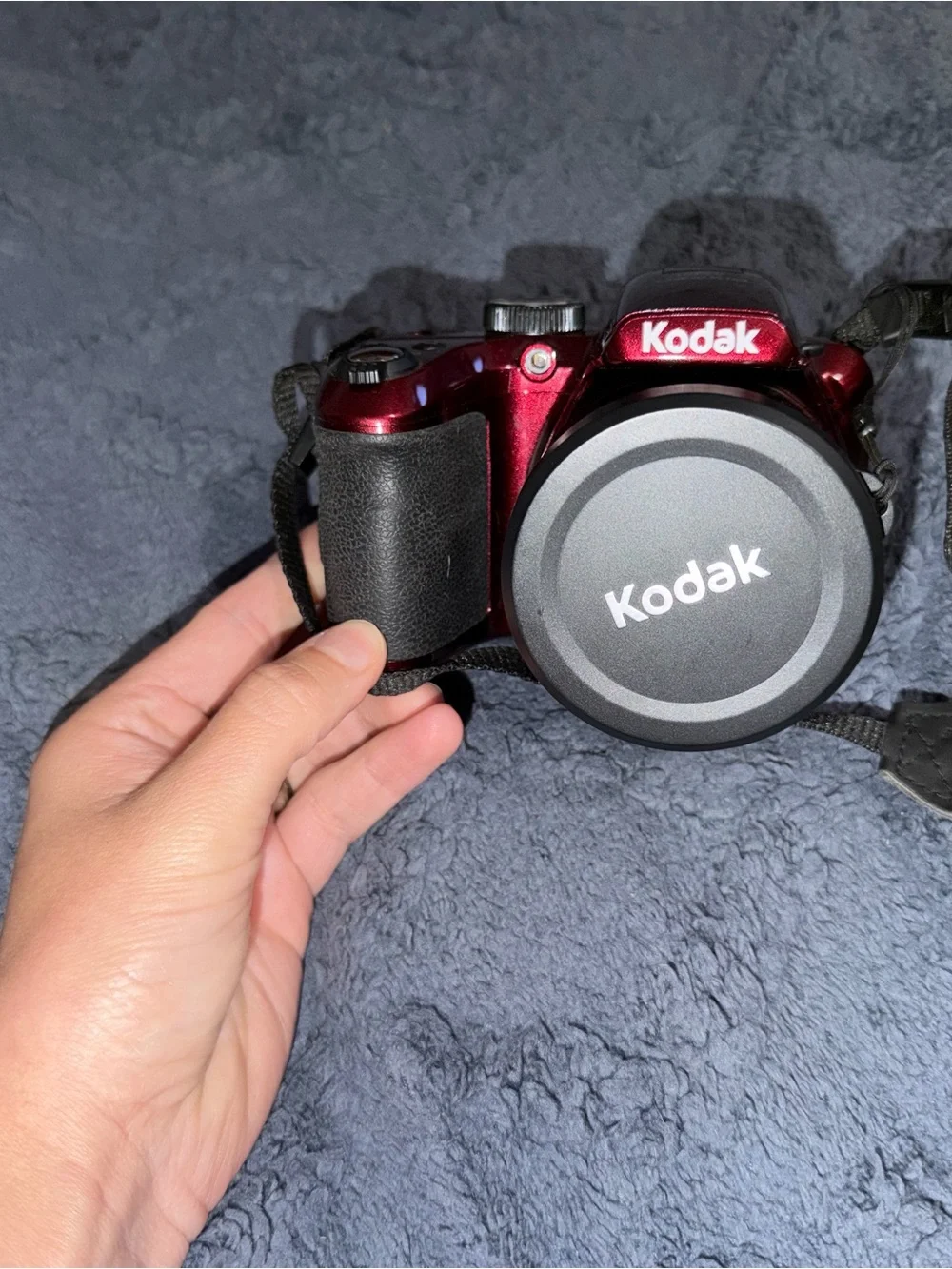Kodak Red Digital Camera and black cannon digital camera